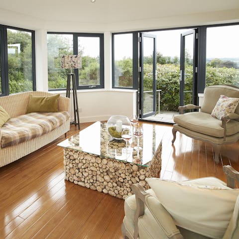 Throw open the doors and admire the views from the sitting room 