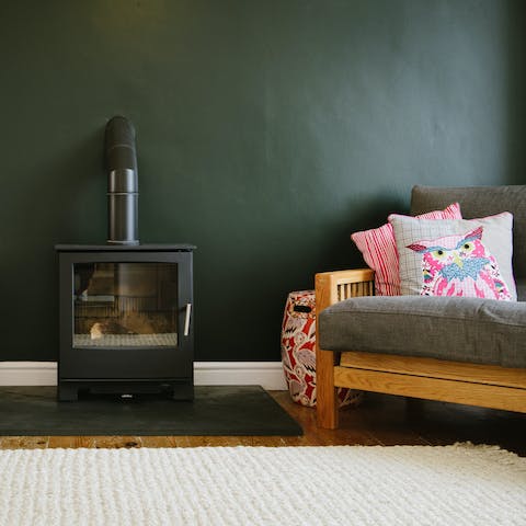 Curl up by the living room's wood-burner on cooler evenings with a glass of wine