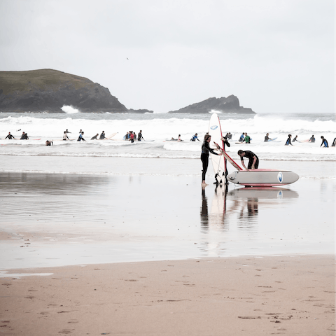 Try your hand at surfing at famous Fistral Beach, a ten-minute walk away