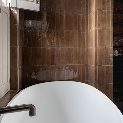 Enjoy a long, relaxing soak in the main suite's rolltop bath