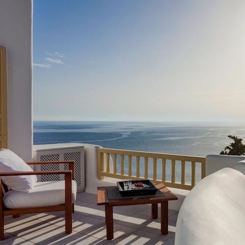 Enjoy your morning coffee with breathtaking views over the Aegean Sea