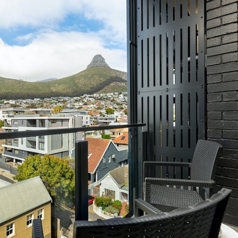 Sip sundowners as you gaze out across Cape Town to Lion's Head