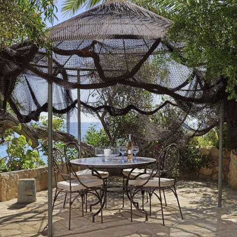 Dine alfresco on the sun-dappled balcony