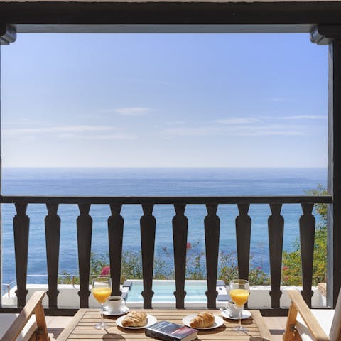 Enjoy breakfast overlooking the sea