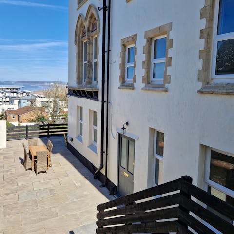 Tuck into fish and chips in the courtyard – you can even see the sea