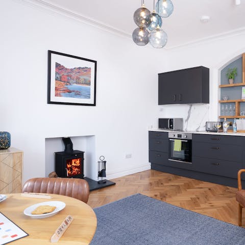 Warm up in front of the little log burner in the open-plan living space