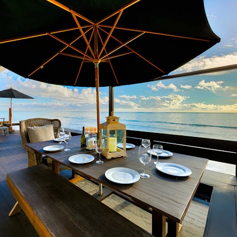 Dine with sweeping ocean views on the deck