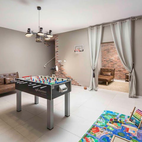 Keep the kids busy with table football in this games room