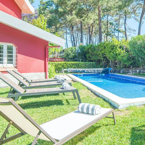 Sprawl out on the lounge chairs after a dip in the swimming pool