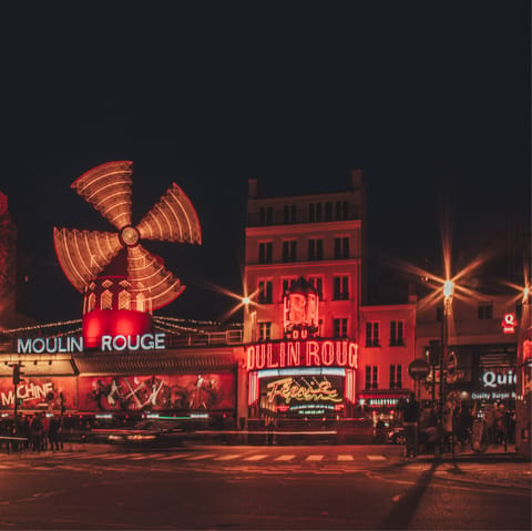 Catch dinner and a show at the iconic Moulin Rouge, a quick six-minute walk away