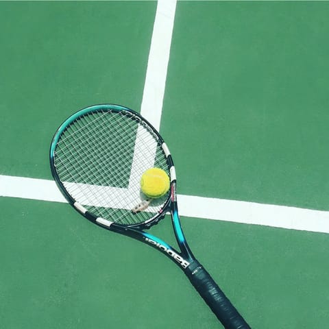 Practise your backhand on the private tennis court