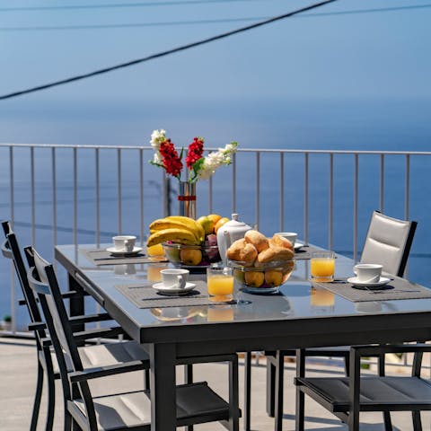 Tuck into delicious pastel de natas with your morning coffee at your alfresco dining table