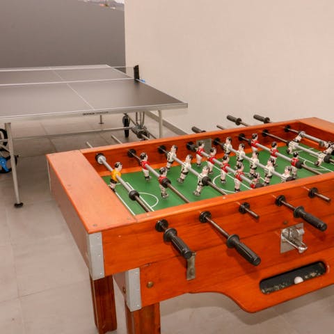 Challenge friends and family to a game of ping pong or a round on the football table
