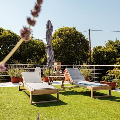 Soak up some Greek sunshine from the elevated sunbathing terrace