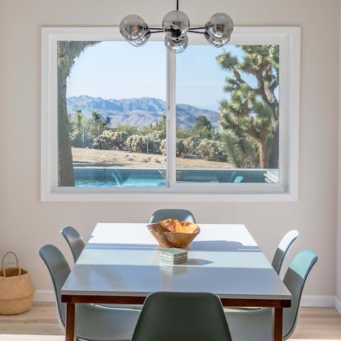 Take in dramatic mountain views from the indoor dining table