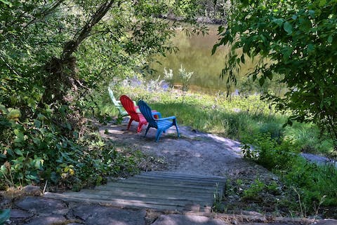 Enjoy direct private access to the Russian River, with seating to relax on