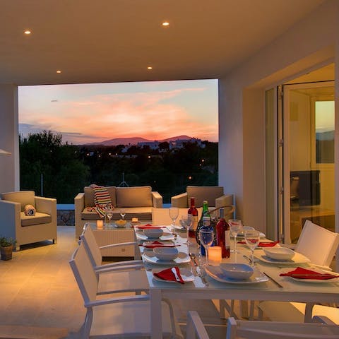 Watch the sunset while enjoying dinner on the terrace 
