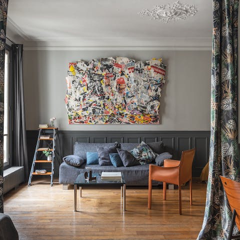 Kick back in the artsy living room with a glass of wine after a day of Paris sightseeing