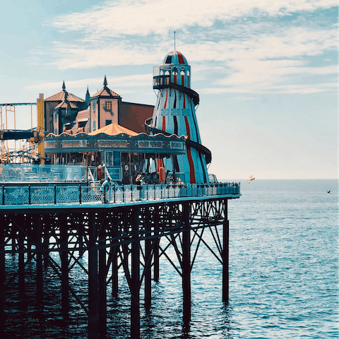 Eat fish and chips on Brighton Beach, a short walk away