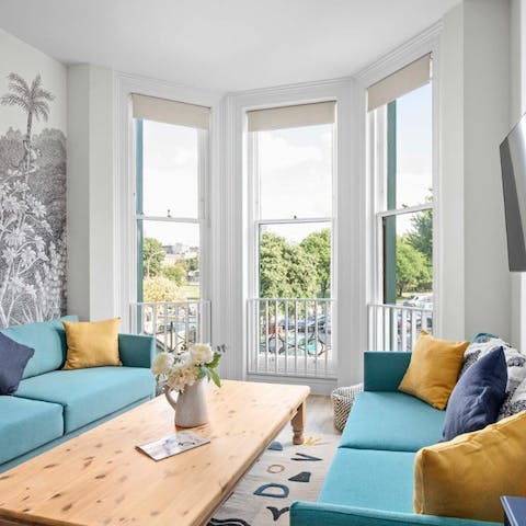 Savour cups of coffee beside the large bay windows, overlooking greenery