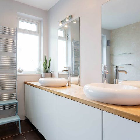Wash up in the sleek bathroom with double vanity sinks
