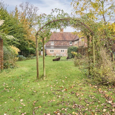 Watch the little ones playing in the garden from the outside seating area