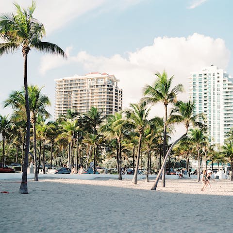 Slip into your sliders and walk the quarter mile to Miami Beach – where the highrise skyline meets the sea