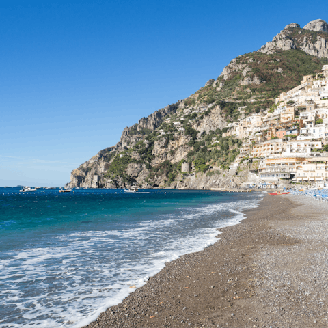 Stroll along Positano Beach, a short distance from the apartment