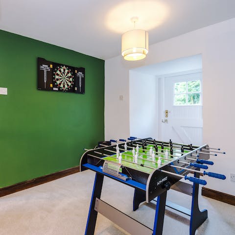Challenge a fellow guest to a competitive game of foosball or darts