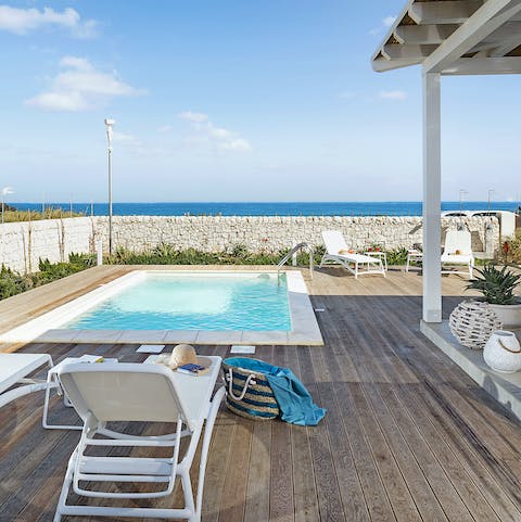 Spend dreamy days lounging by the pool or make your down to the water's edge