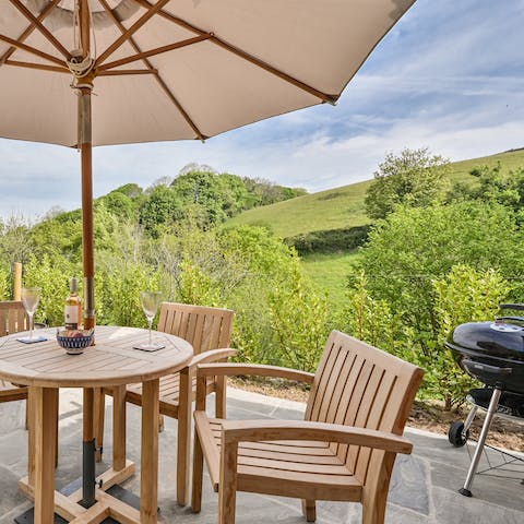 Fire up the barbecue and dine alfresco accompanied by views of the Devon countryside