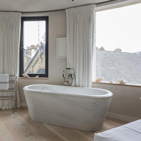 Enjoy a luxurious soak in the freestanding bathtub