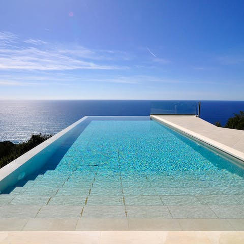 Watch the sunset from the edge of your shimmering infinity pool