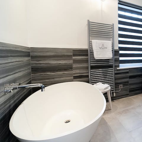 Unwind after a day exploring in one of the four freestanding bath tubs