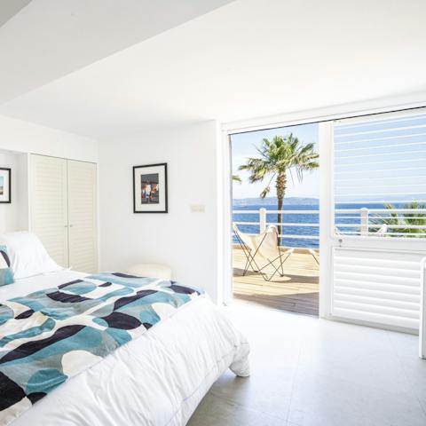 Pad out onto the bedroom's terrace and soak up the sea views