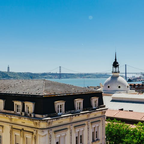 Look out to spectacular views of the 25 de Abril Bridge