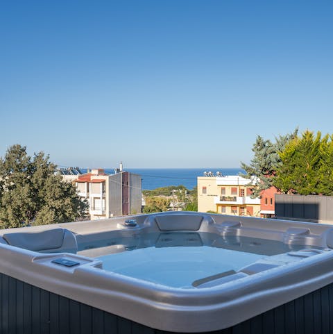Slip into the waters of the Jacuzzi tub on the patio with stunning views of the sea horizon