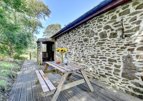 Sit down to al fresco tipples when you arrive at the cottage