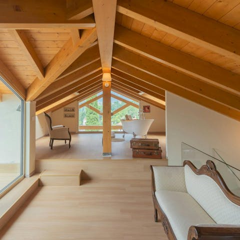 Relax in the freestanding bath tub with its lake and mountain views