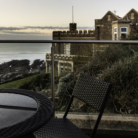 Pour yourself a glass of wine, pad out to the private balcony, and watch the seafront sunset