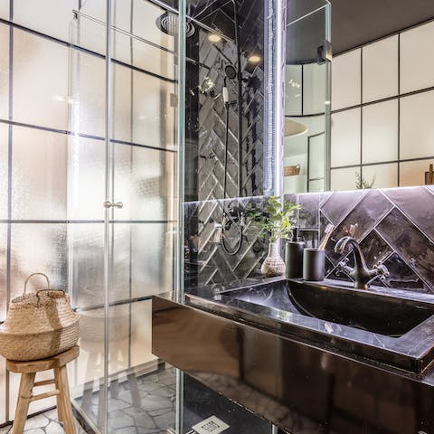 Pamper yourself in the swish bathroom with its luxurious rainfall shower