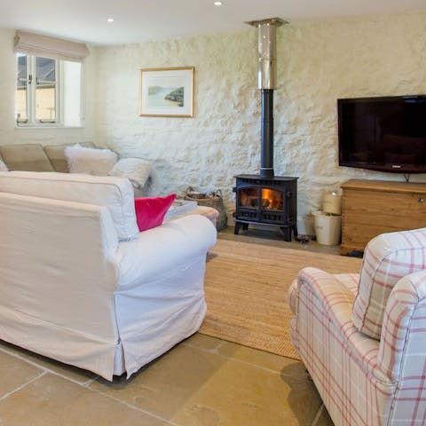 Light the wood-burning stove and get cosy on the soft sofa