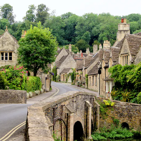 Wander through the honey-coloured villages of the Cotswolds – Bibury is a thirty-minute drive away