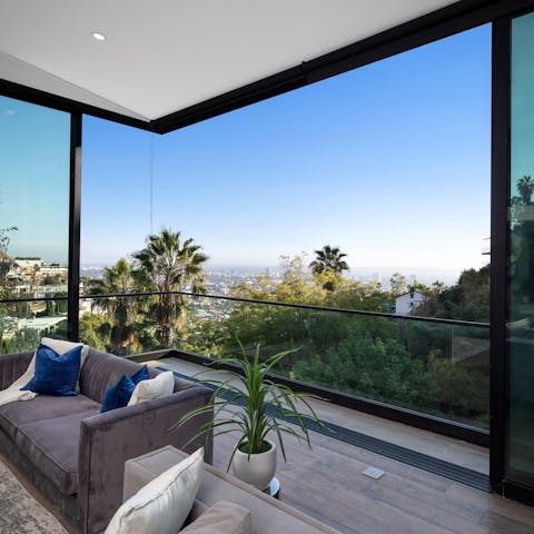 Take in those spectacular skyline views from the comfort of your living room