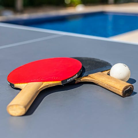 Get competitive over a game of poolside ping pong