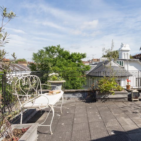 Enjoy your morning coffee on the sunny rooftop terrace