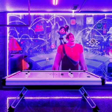 Play air hockey amongst your favourite Disney characters