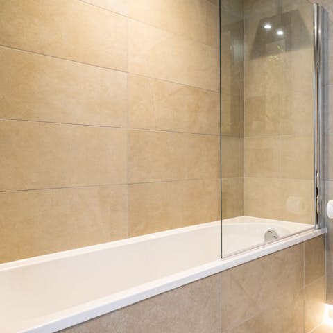 Treat yourself to an uninterrupted soak in the home's sleek bathtub