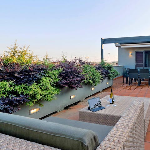 Watch the sunset with a bottle of wine on your private rooftop patio