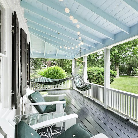 Enjoy a peaceful moment on the whitewashed porch